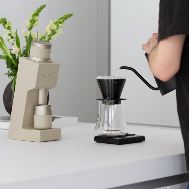 Brewing pour-over coffee next to the Varia VS4 in sand